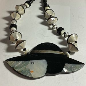 Beautiful abalone lady in a hat necklace